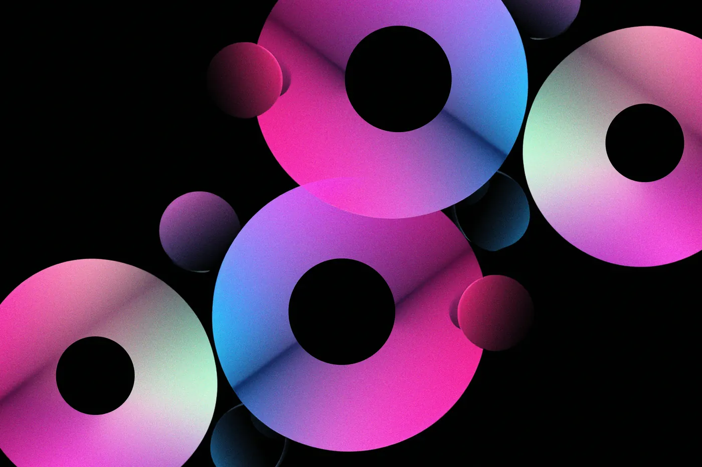 Pink, blue and green discs floating against black